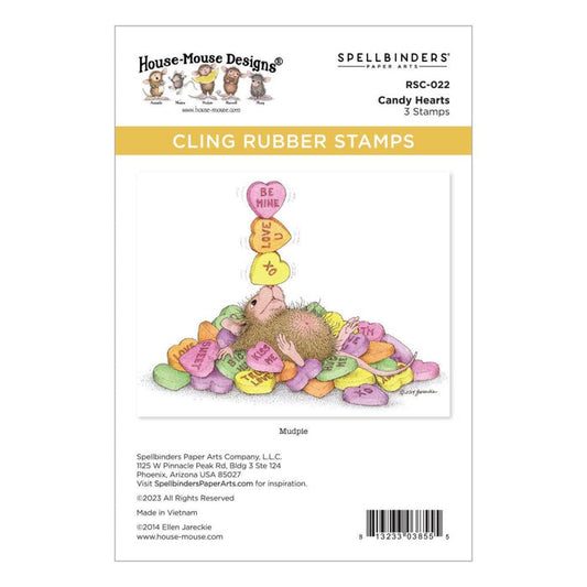 Spellbinders - House Mouse - Cling Rubber Stamp - Candy Hearts. This set is part of the House-Mouse Designs Everyday Collection with a set of three stamps. Playful Mudpie lies on a pile of candy hearts while juggling a few on her nose. Available at Embellish Away located in Bowmanville Ontario Canada.