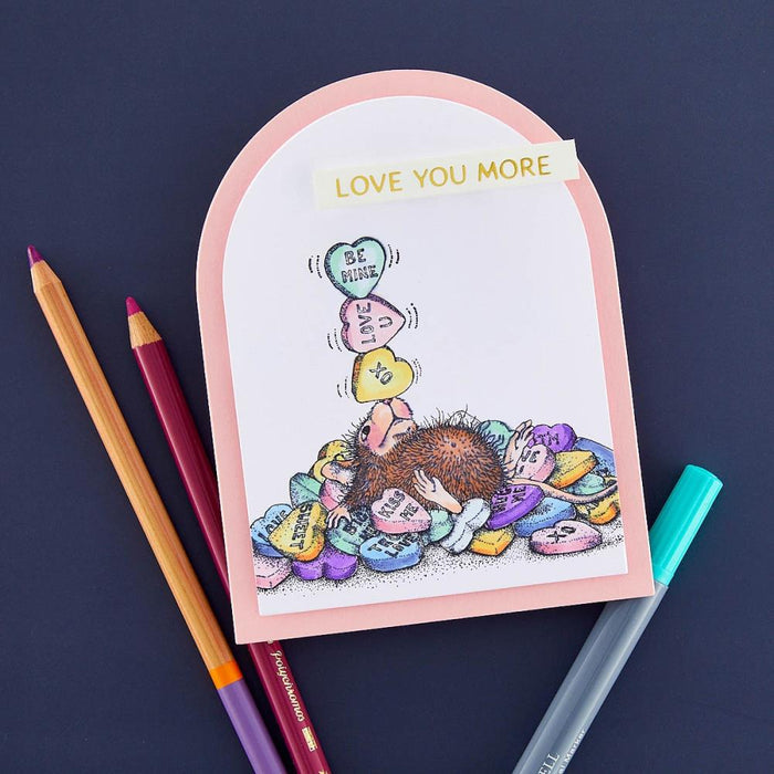 Spellbinders - House Mouse - Cling Rubber Stamp - Candy Hearts. This set is part of the House-Mouse Designs Everyday Collection with a set of three stamps. Playful Mudpie lies on a pile of candy hearts while juggling a few on her nose. Available at Embellish Away located in Bowmanville Ontario Canada. Example by brand ambassador.