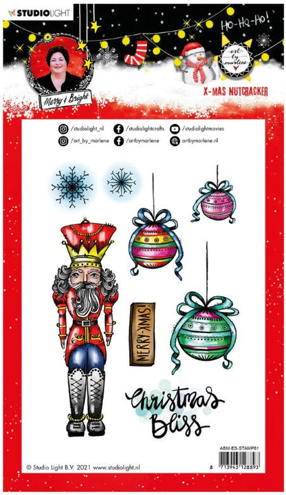 Studio Light - ABM Clear Stamp - Christmas Nutcracker - Essentials - 148x210x1mm - 1 PC - nr.81. This clear stamp set features a Nutcracker, ornaments, snowflakes and also the perfect Christmas and Winter sentiments. 8 stamps. Size: 5.8x8.3 in. Available at Embellish Away located in Bowmanville Ontario Canada.