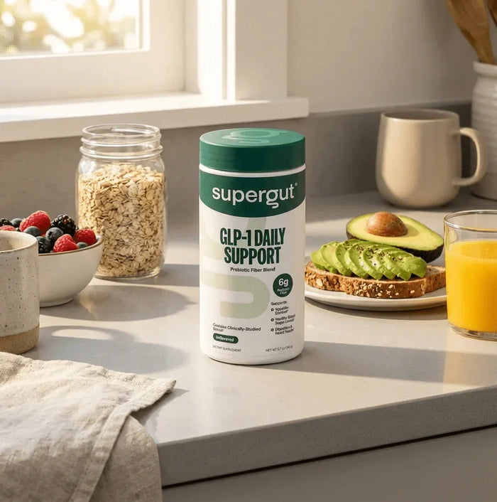 Supergut GLP-1 Daily Support prebiotic fiber powder on kitchen counter with breakfast foods