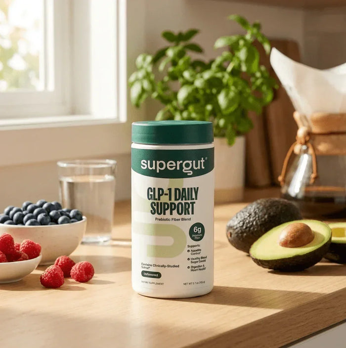 Supergut GLP-1 Daily Support prebiotic fiber powder container on kitchen counter with fruit