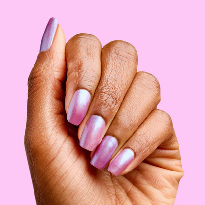 Hand with nails painted in shiny purple-blue iridescent duochrome using SWAK quick dry polish by Olive and June