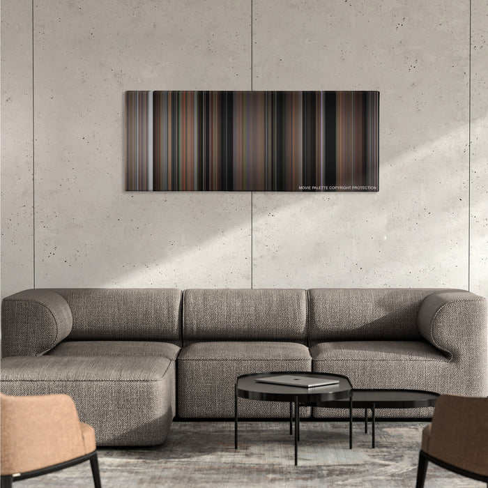 The Blair Witch Project color palette canvas on a concrete wall above a gray sectional sofa