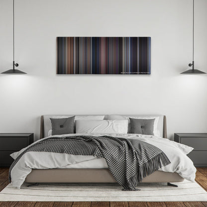 The Fly color palette canvas above a bed, between two black pendant lamps