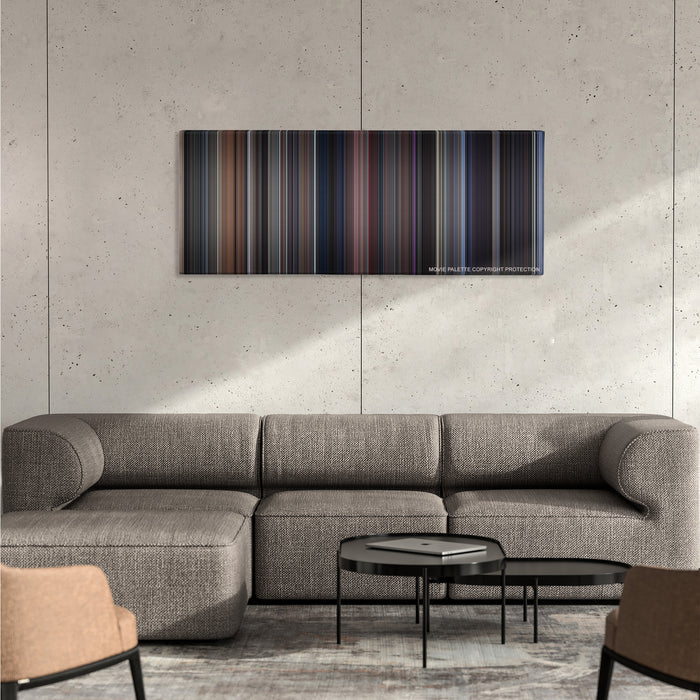 The Fly color palette canvas on a concrete wall above a gray sectional sofa