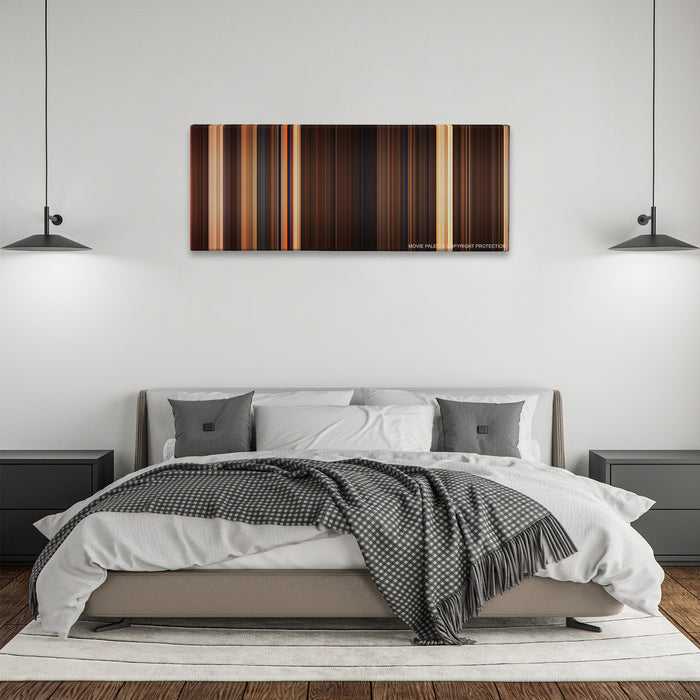 The Mummy color palette canvas above a bed, between two black pendant lamps