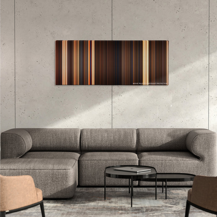 The Mummy color palette canvas on a concrete wall above a gray sectional sofa