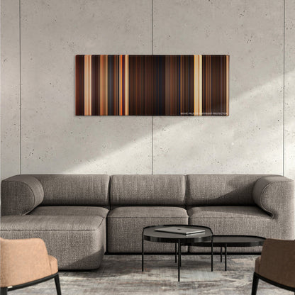 The Mummy color palette canvas on a concrete wall above a gray sectional sofa