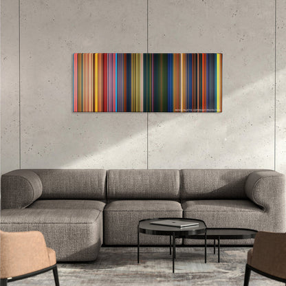 The Princess and the Frog color palette canvas on a concrete wall above a gray sectional sofa