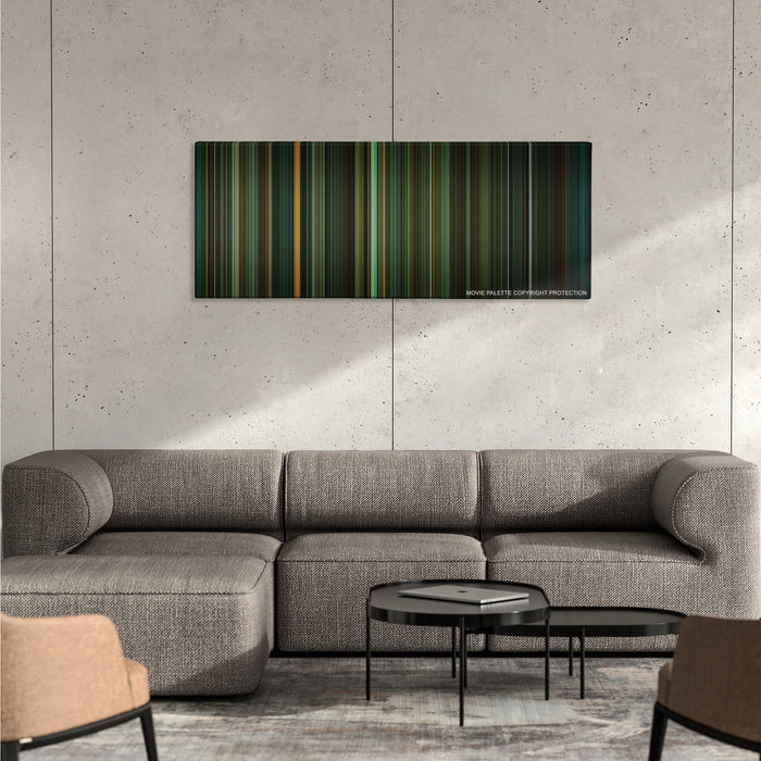 The Shape of Water color palette canvas on a concrete wall above a gray sectional sofa