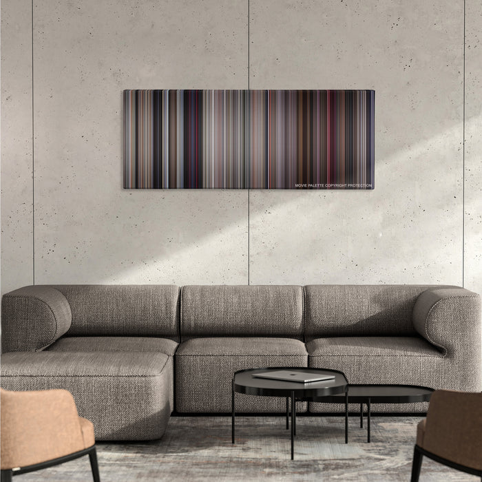They Live color palette canvas on a concrete wall above a gray sectional sofa
