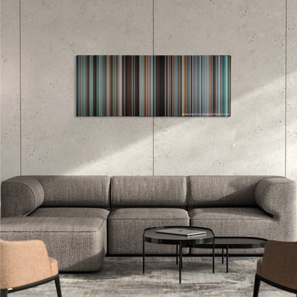 Tower Heist color palette canvas on a concrete wall above a gray sectional sofa