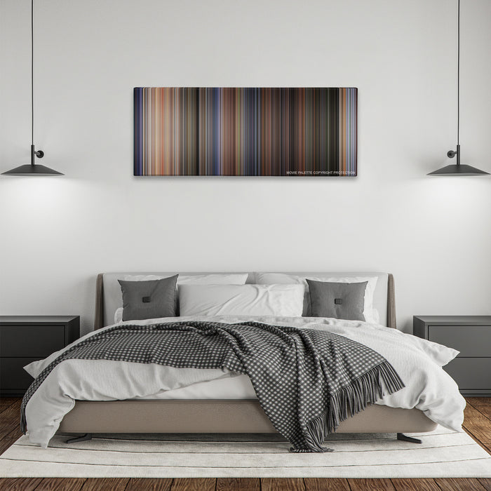Twister color palette canvas above a bed, between two black pendant lamps