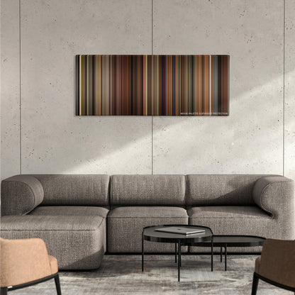 Walk the Line color palette canvas on a concrete wall above a gray sectional sofa